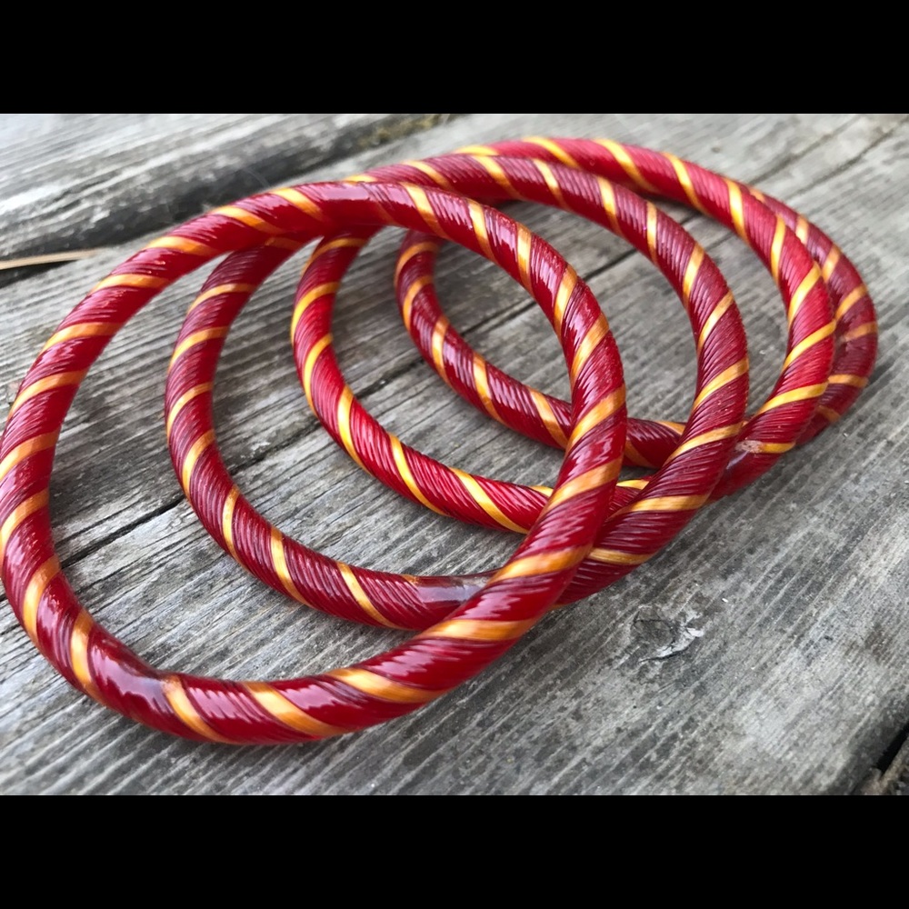Three red, glass bangles